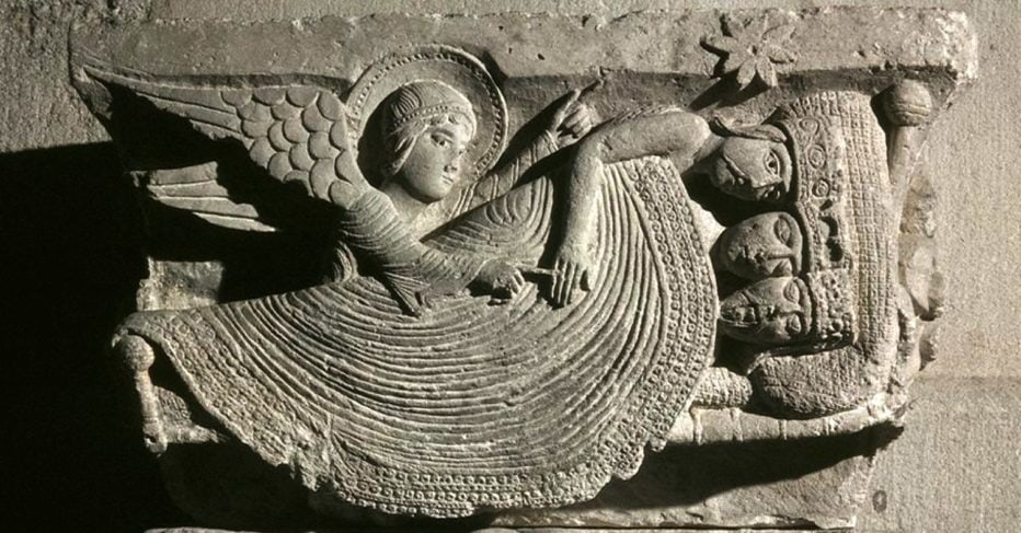 A stone engraving shows an angel directing the 3 wise men as they sleep