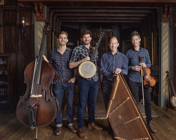 The Ken & Brad Kolodner Quartet stand with their instruments