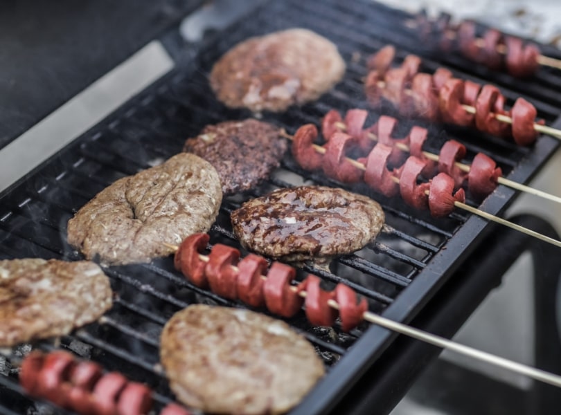 Grill with hotdogs and hamburgers
